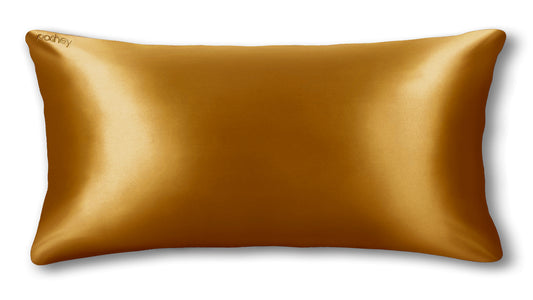 gold-colored silk pillowcase